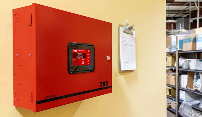 Commercial fire alarm control panel on wall
