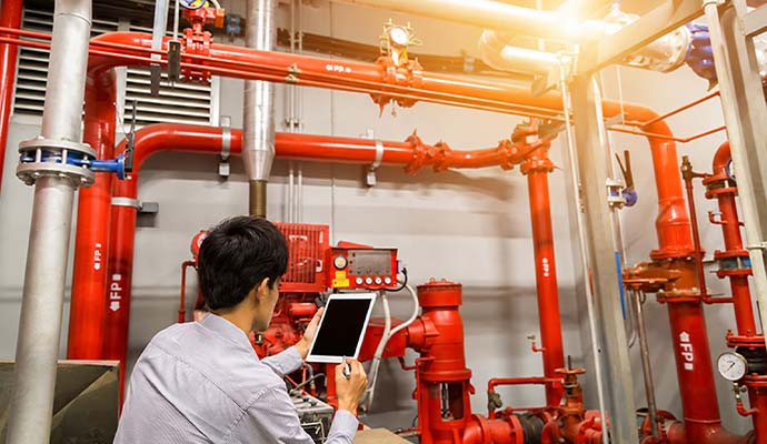 Fire alarm system inspected by technician